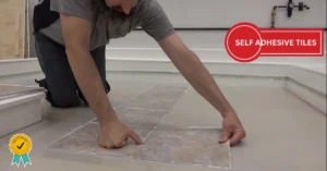 Self adhesive tiles being installed on floor using peel and stick method